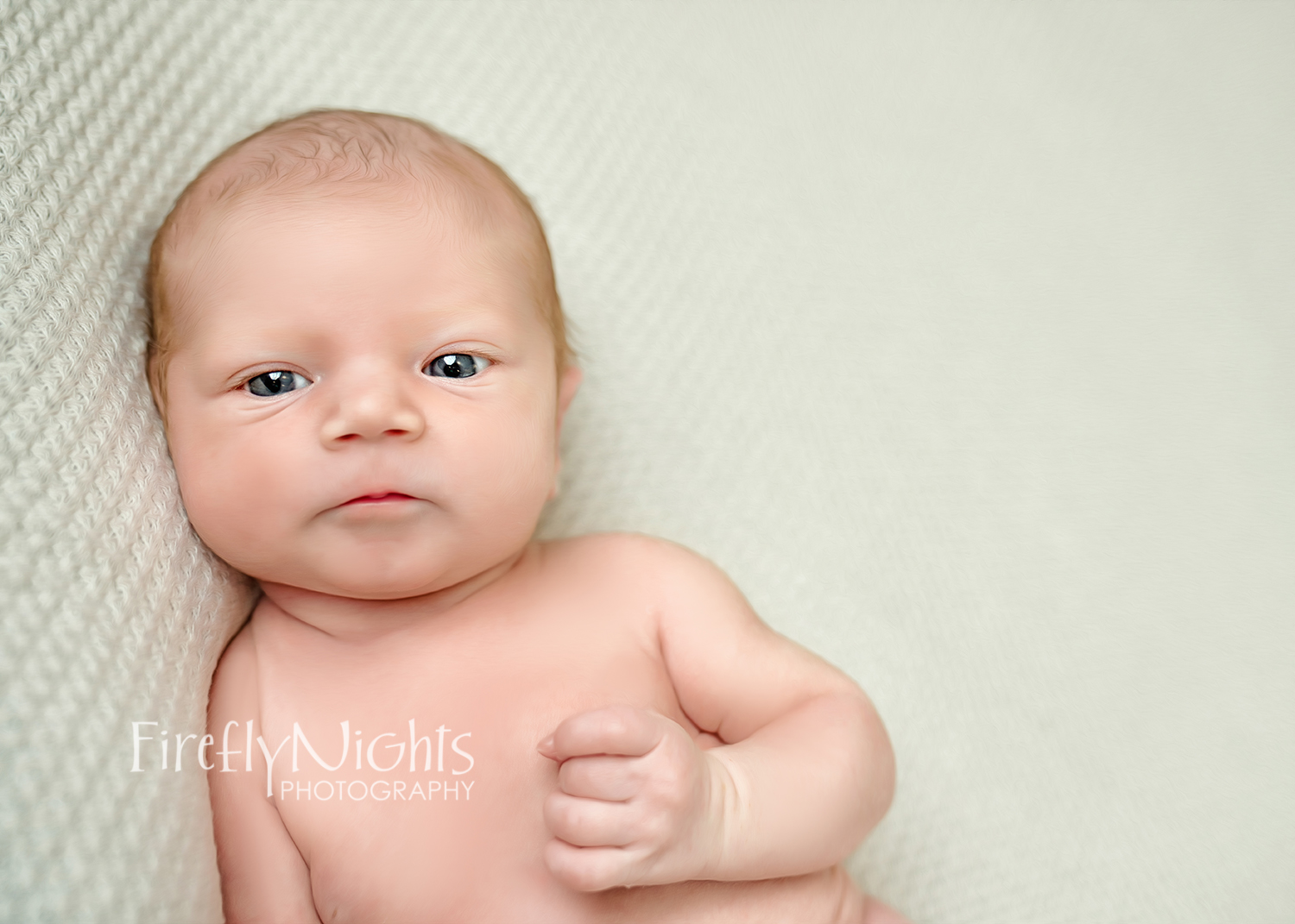 Newborn baby eyes open photo in Naperville photography